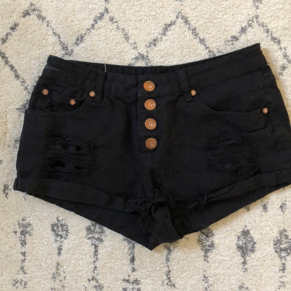 Mid rise distressed cut off denim shorts